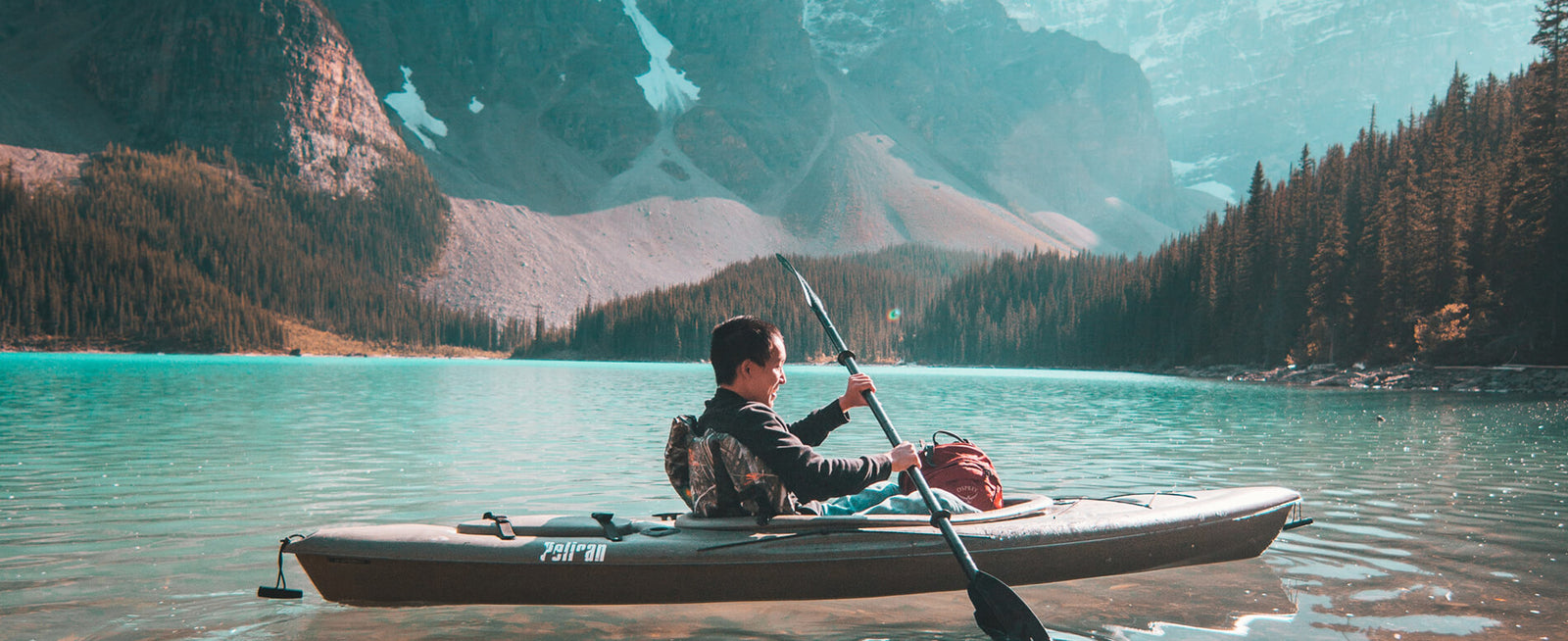 Man kayaking on lake
