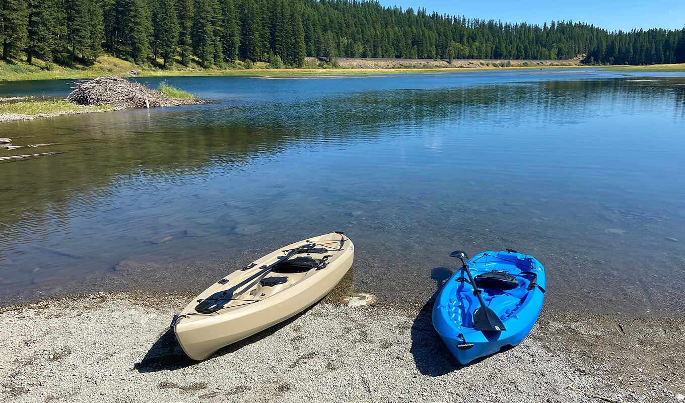 Blue and white kayak on lake side