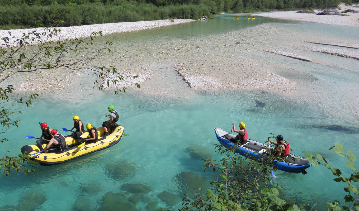 Yellow and blue inflatable kayak on body of water
