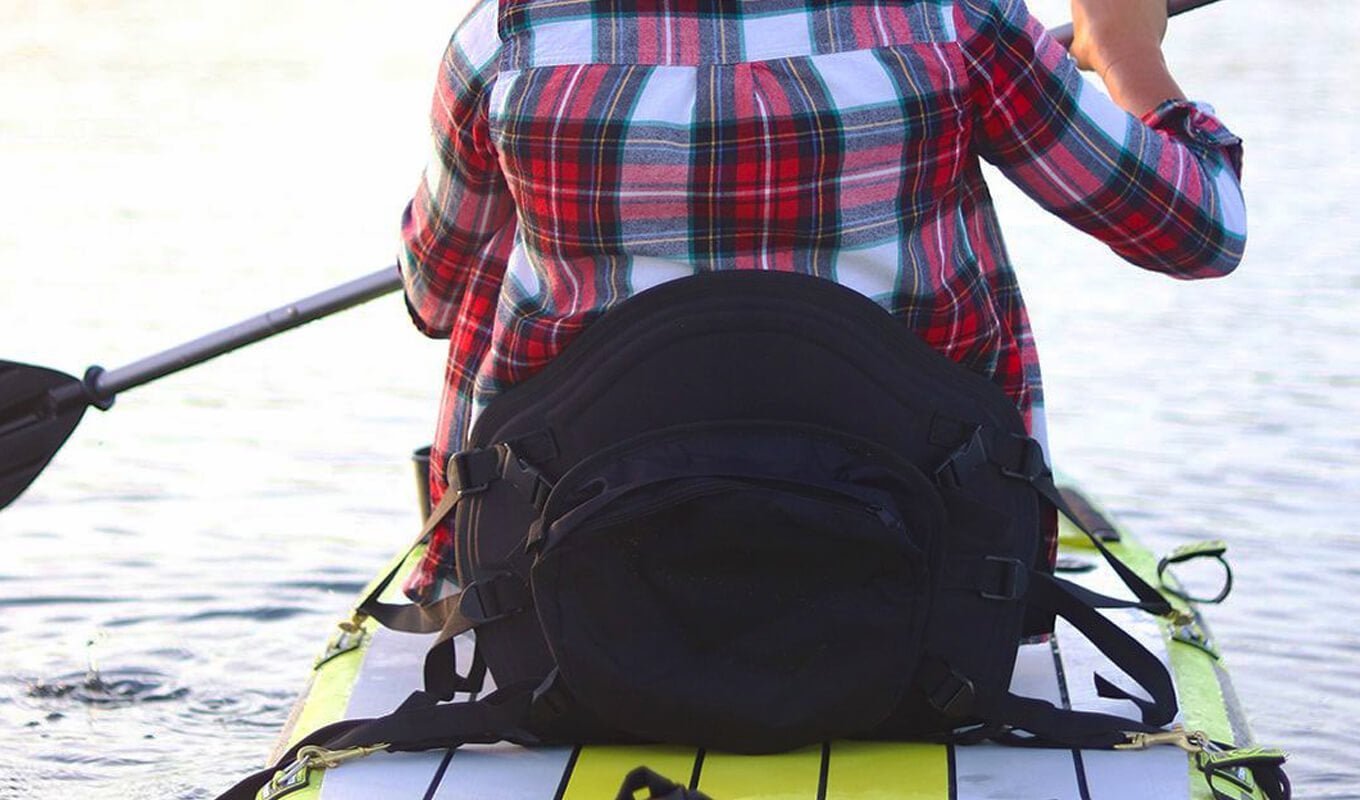 Kayak seat attached to inflatable paddle board