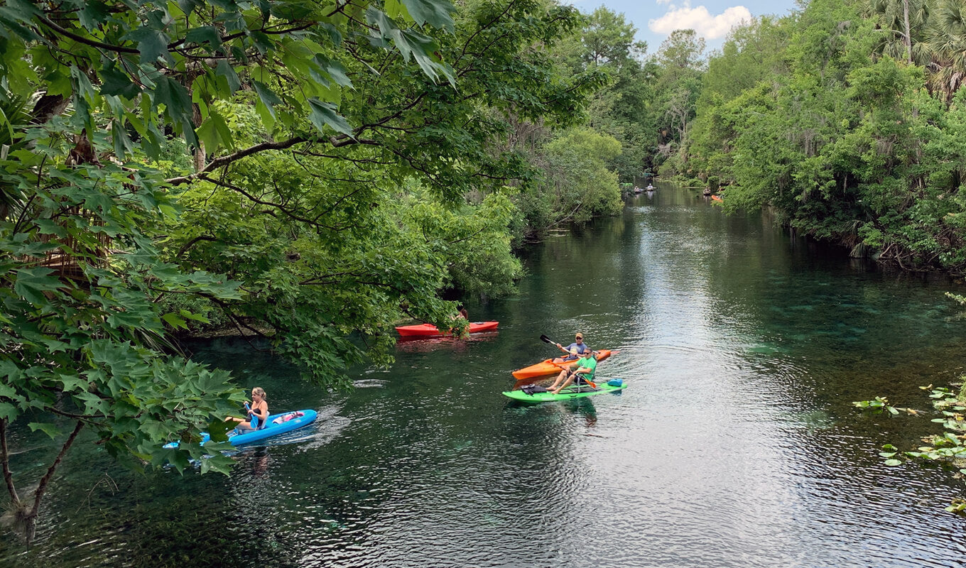 colorful kayaks on a river