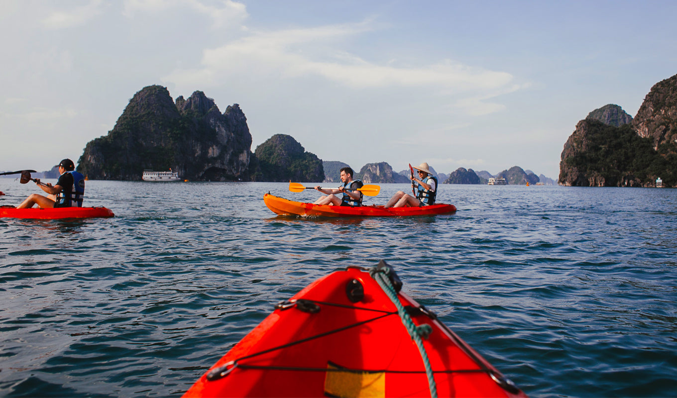 Red hardshell kayak on a lake